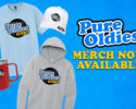 Promotional image for Pure Oldies merch (106.9 FM): logoed light-blue T‑shirt, gray hoodie, white cap, red mug displayed on a blue background with bold “Pure Oldies” and “MERCH NOW AVAILABLE” text.