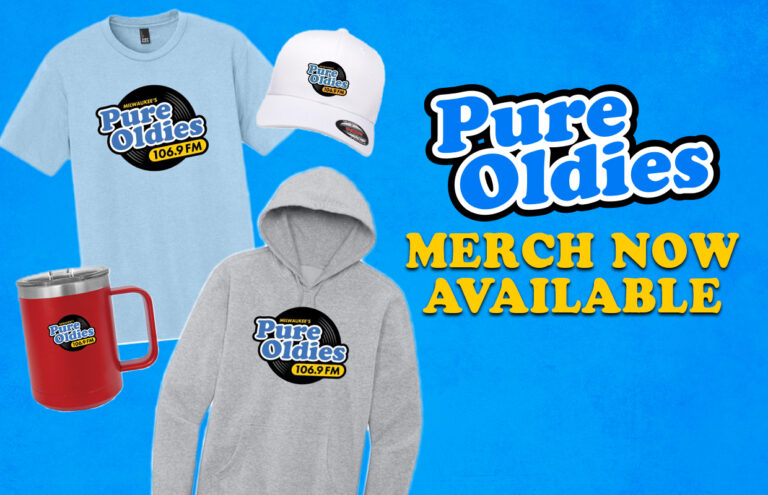 Promotional image for Pure Oldies merch (106.9 FM): logoed light-blue T‑shirt, gray hoodie, white cap, red mug displayed on a blue background with bold “Pure Oldies” and “MERCH NOW AVAILABLE” text.